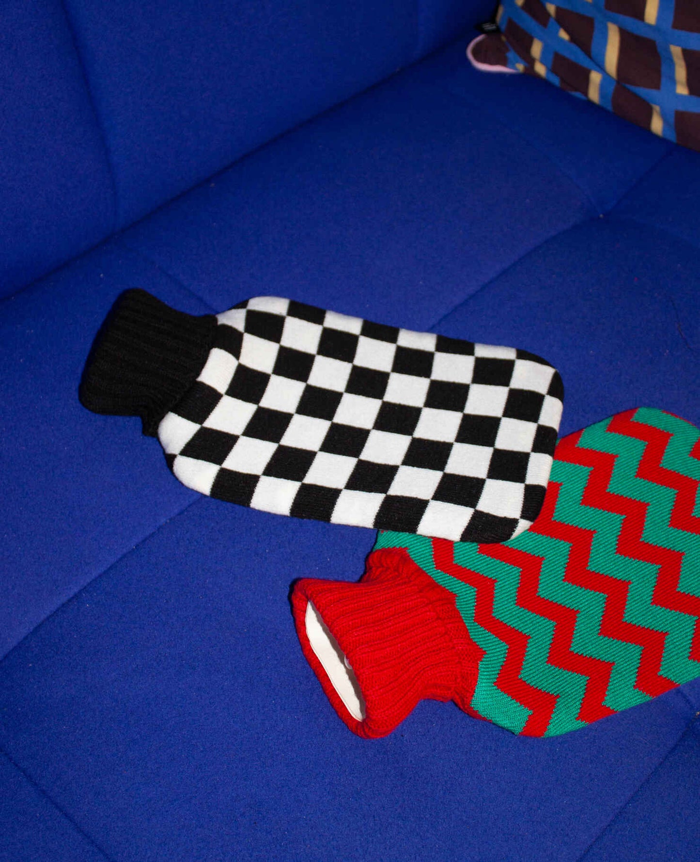 Noir Hot Water Bottle with Cover - Casa Rolio organic, colourful, designer hot water bottle. Crafted for comfort and style, this vibrant, eco-friendly accessory adds a touch of luxury while keeping you warm and cozy.
