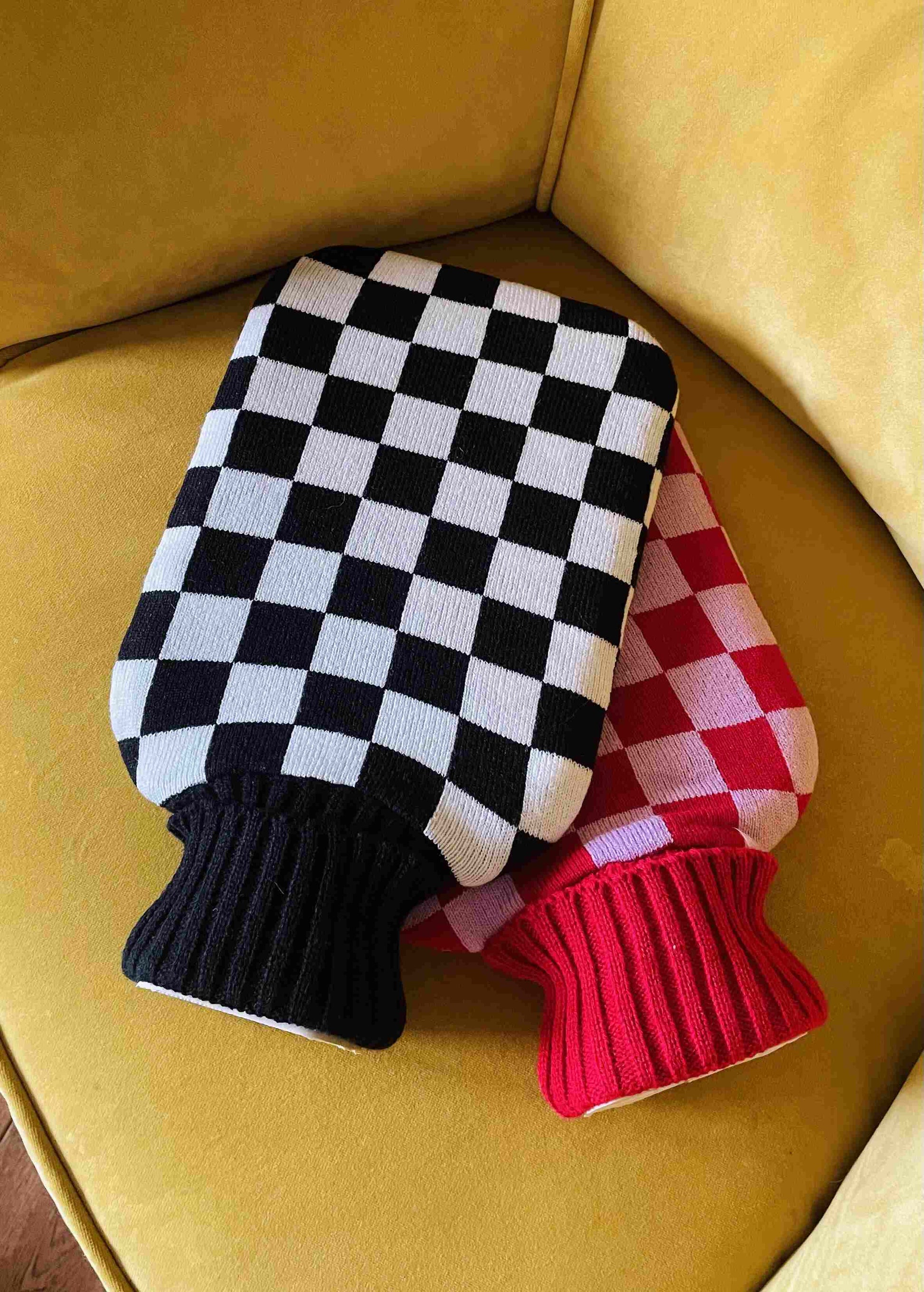 Noir Hot Water Bottle with Cover - Casa Rolio organic, colourful, designer hot water bottle. Crafted for comfort and style, this vibrant, eco-friendly accessory adds a touch of luxury while keeping you warm and cozy.