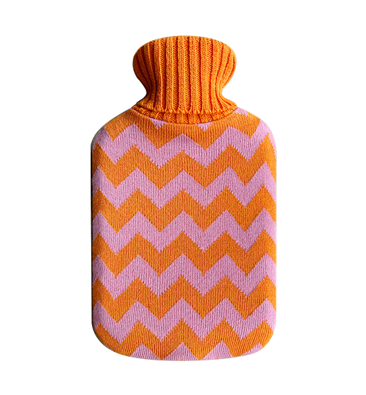 Tangerine Hot Water Bottle with Cover - Casa Rolio organic, colourful, designer hot water bottle. Crafted for comfort and style, this vibrant, eco-friendly accessory adds a touch of luxury while keeping you warm and cozy.