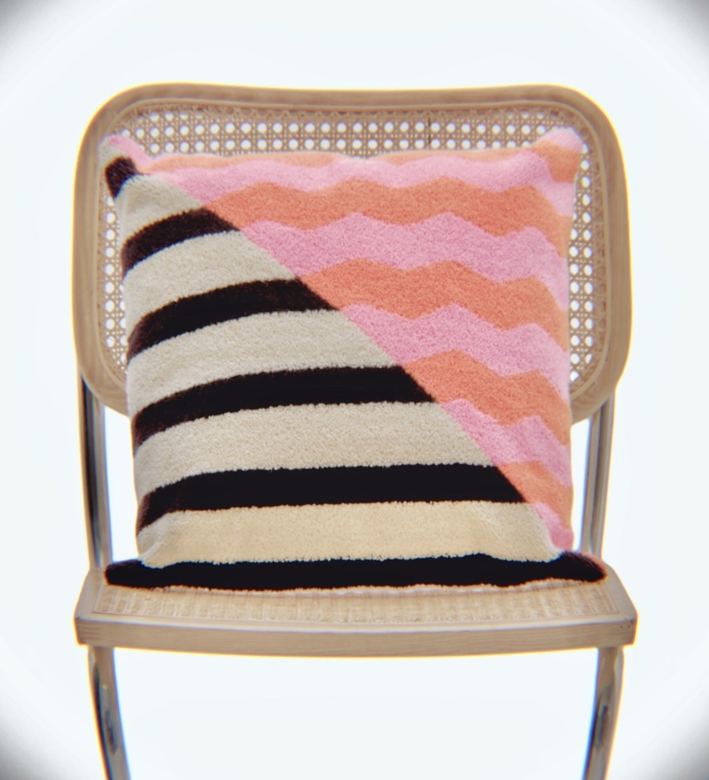 Deconstructed Designer Cushion - Casa Rolio luxury cushion with a deconstructed zigzag and striped pattern in orange, pink, black, and cream. A designer throw pillow to elevate your home decor.